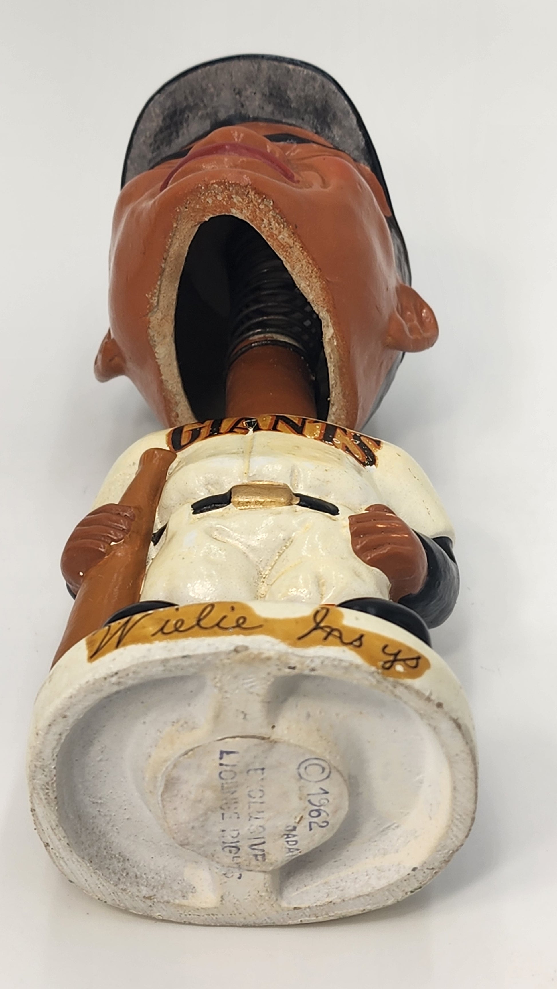 Willie Mays Giants bobblehead base showing Willie Mays script and 1962 copyright stamp