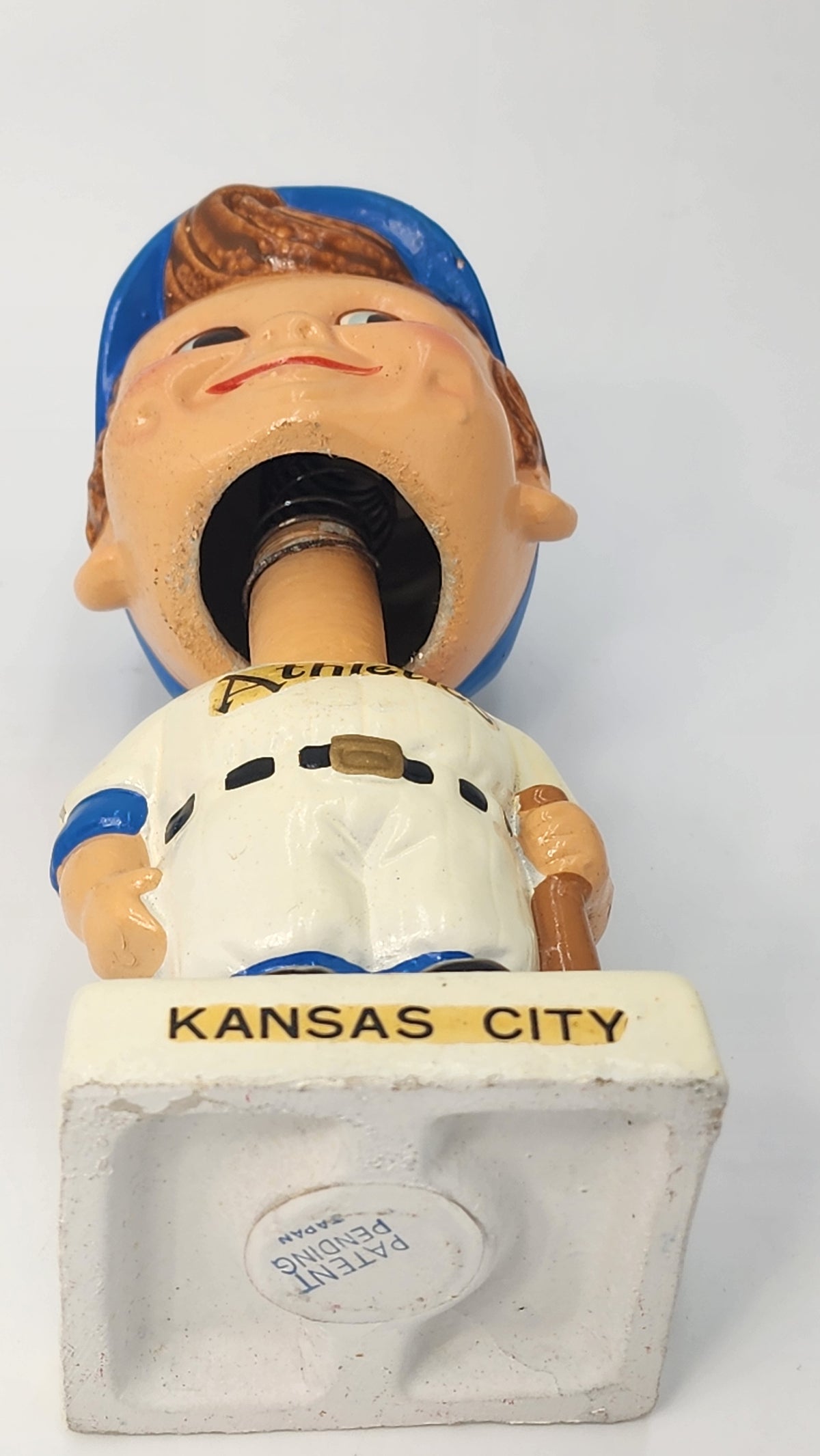 Close-up of Kansas City Athletics bobblehead head and spring