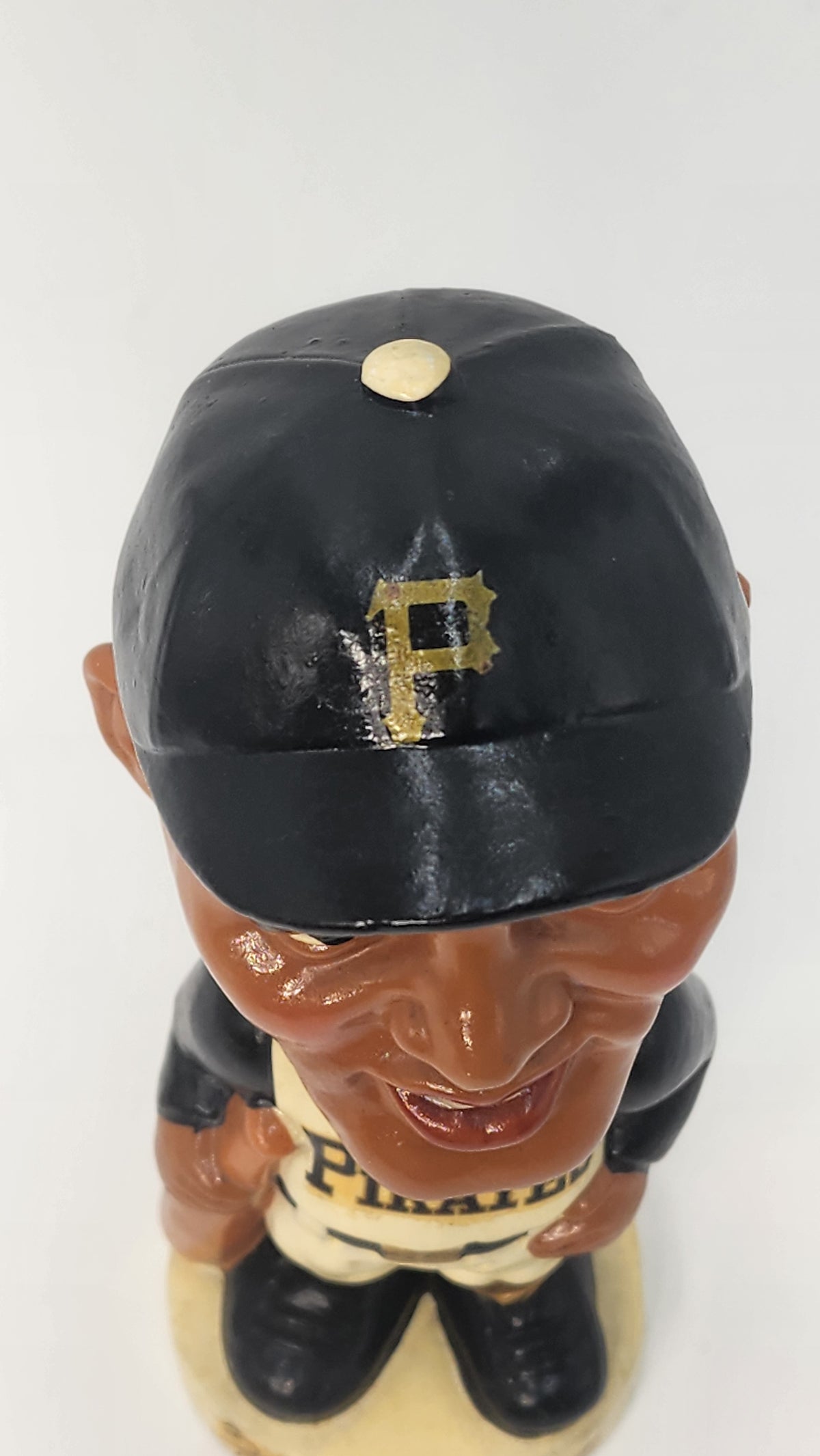 Side view of Roberto Clemente bobblehead holding a bat
