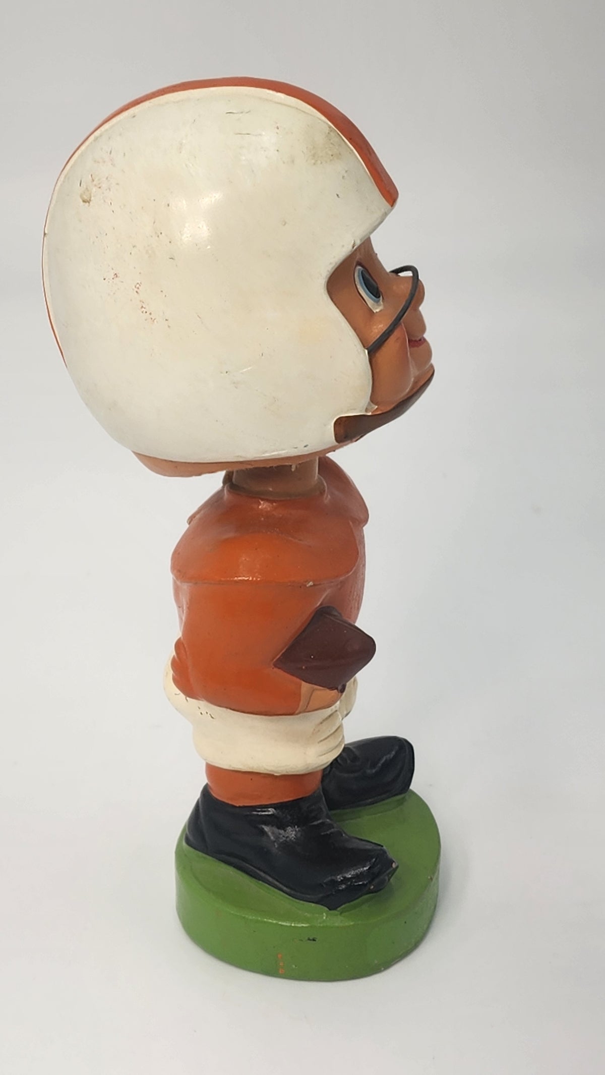 Opposite side view of football player bobblehead