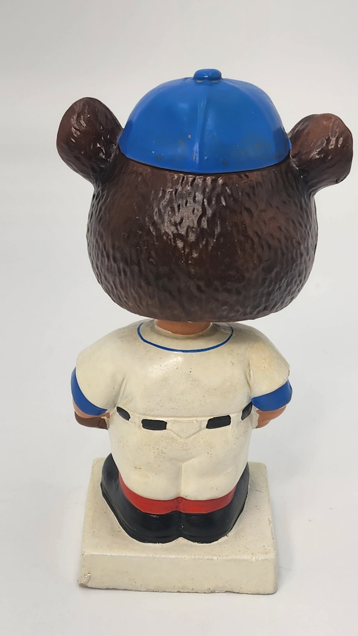 Close-up of Cubs bobblehead head interior and spring