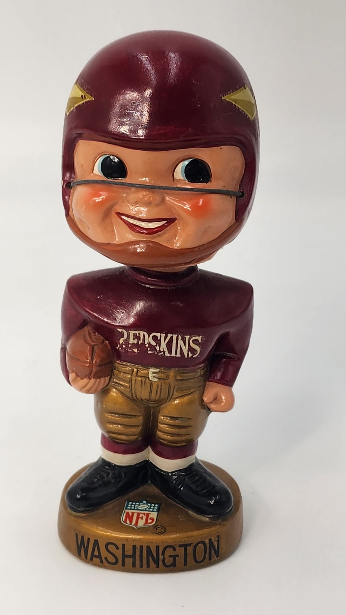 Front view of 1968 Washington Redskins gold base bobblehead